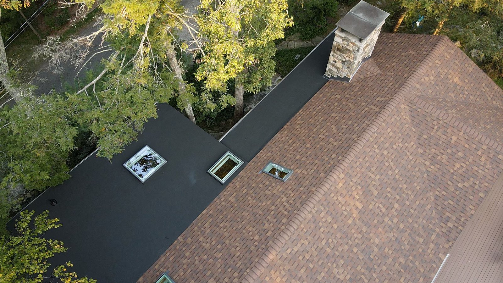 Chimney flashing on a finished Eagle Heights roof replacement in Sherman, CT
